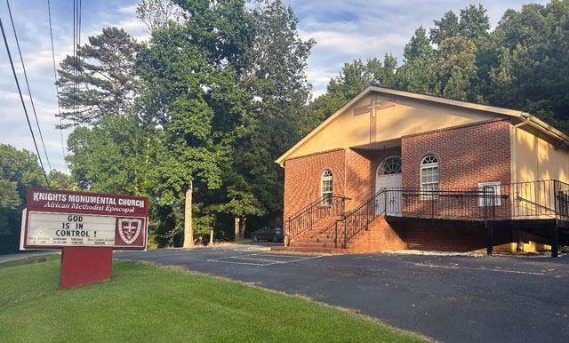 Knights Monumental AME Church building with sign saying God is in control